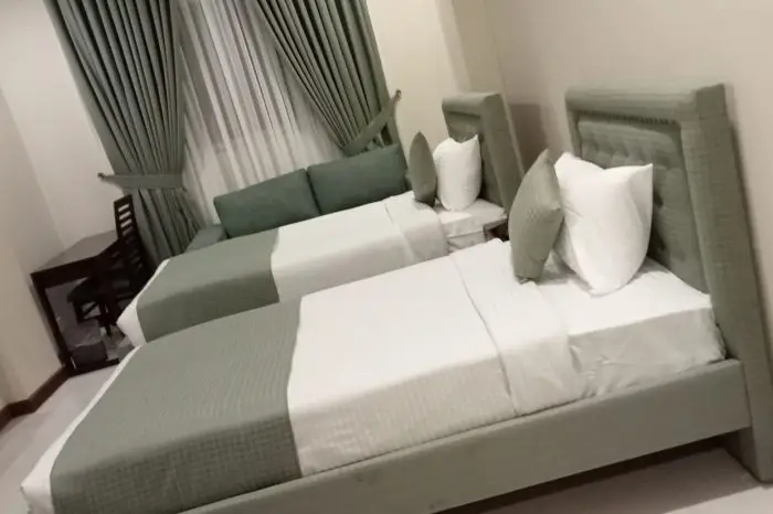 Atlas Grand Hotel Deluxe Room Bed in Islamabad
