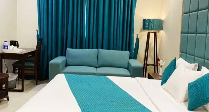 Atlas Grand Hotel Deluxe Room Bed in Islamabad